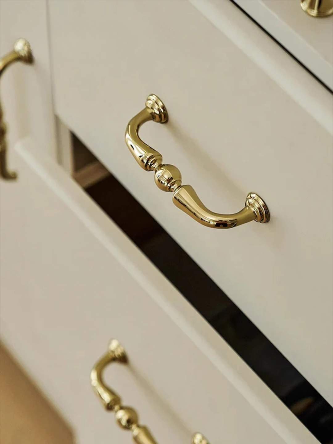 Gold faucet and handles on a beige background