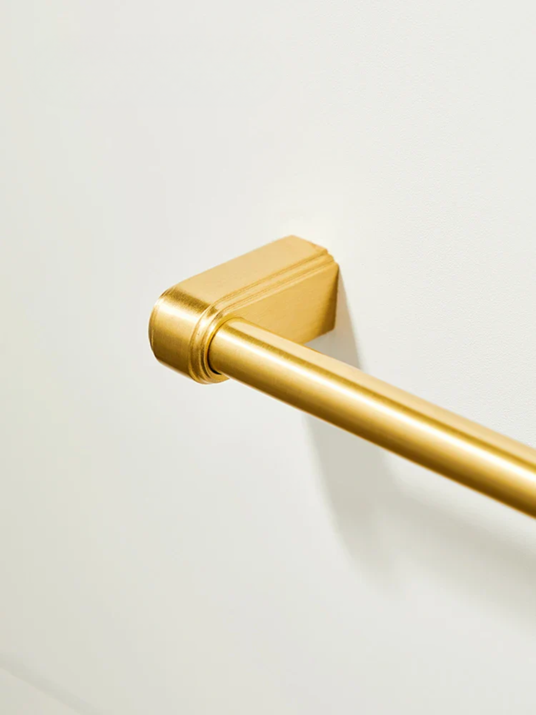 Gold towel bar on a white background