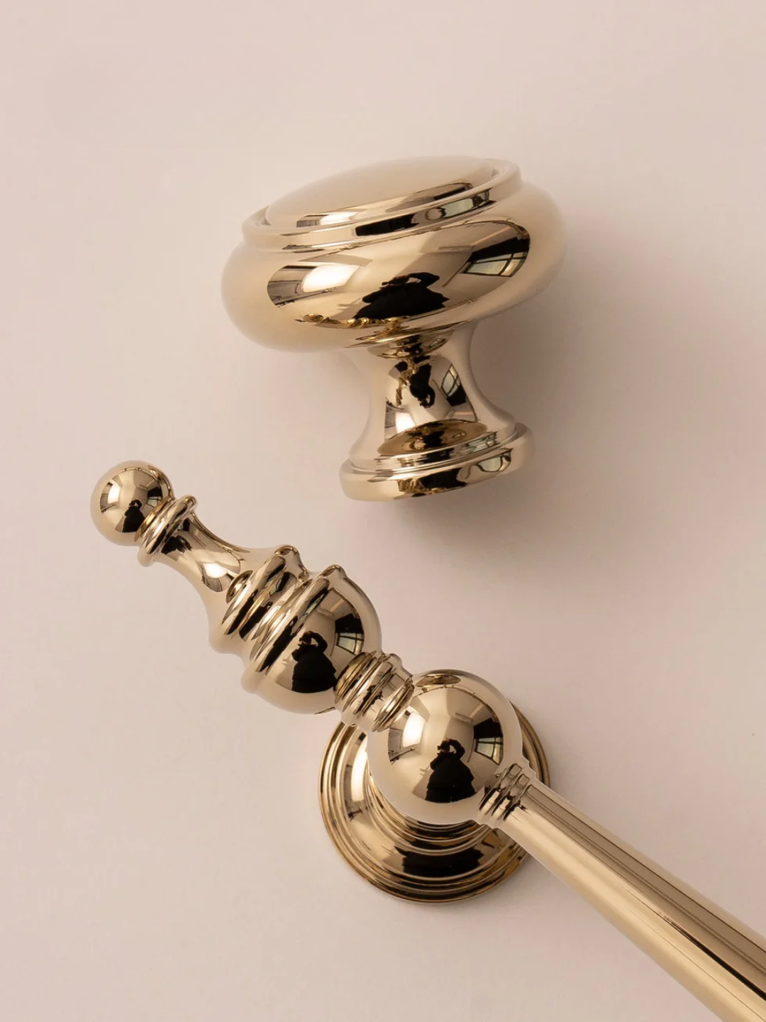 Gold door handle and knob set on a light background