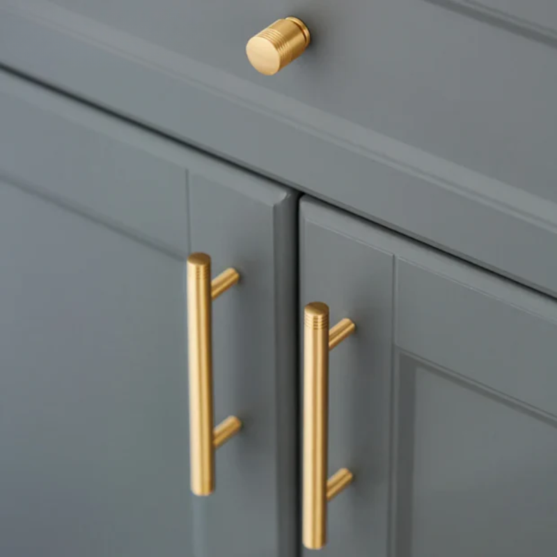 Gray cabinet with gold handles