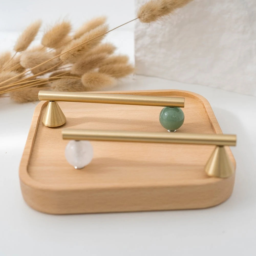 Green decorative accent and brass cabinet knob with matching pull