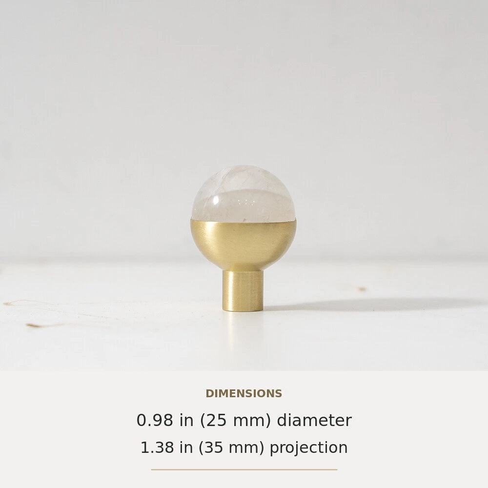 White decorative accent and brass round cabinet knob