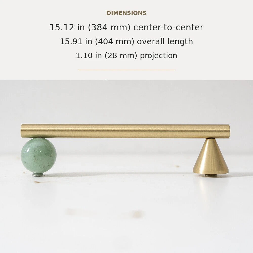 Green decorative accent and brass cabinet pull, 15.12-inch center-to-center