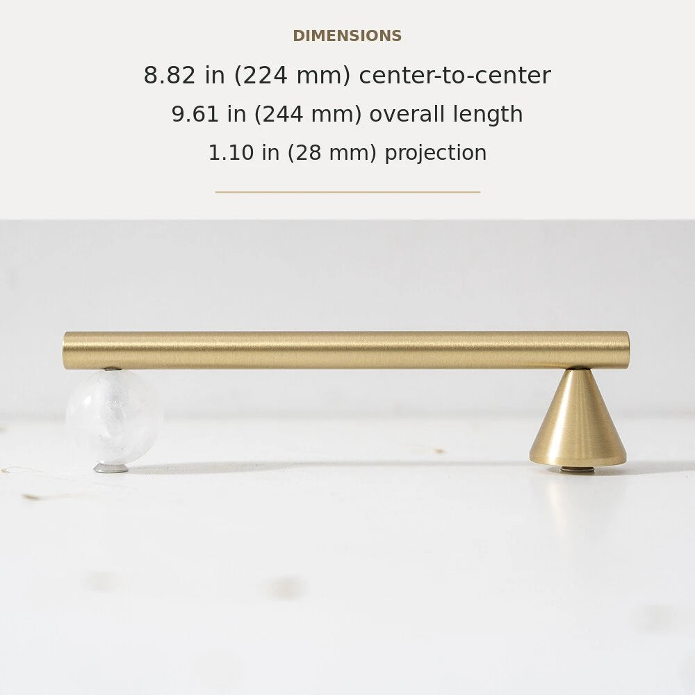 White decorative accent and brass cabinet pull, 8.82-inch center-to-center