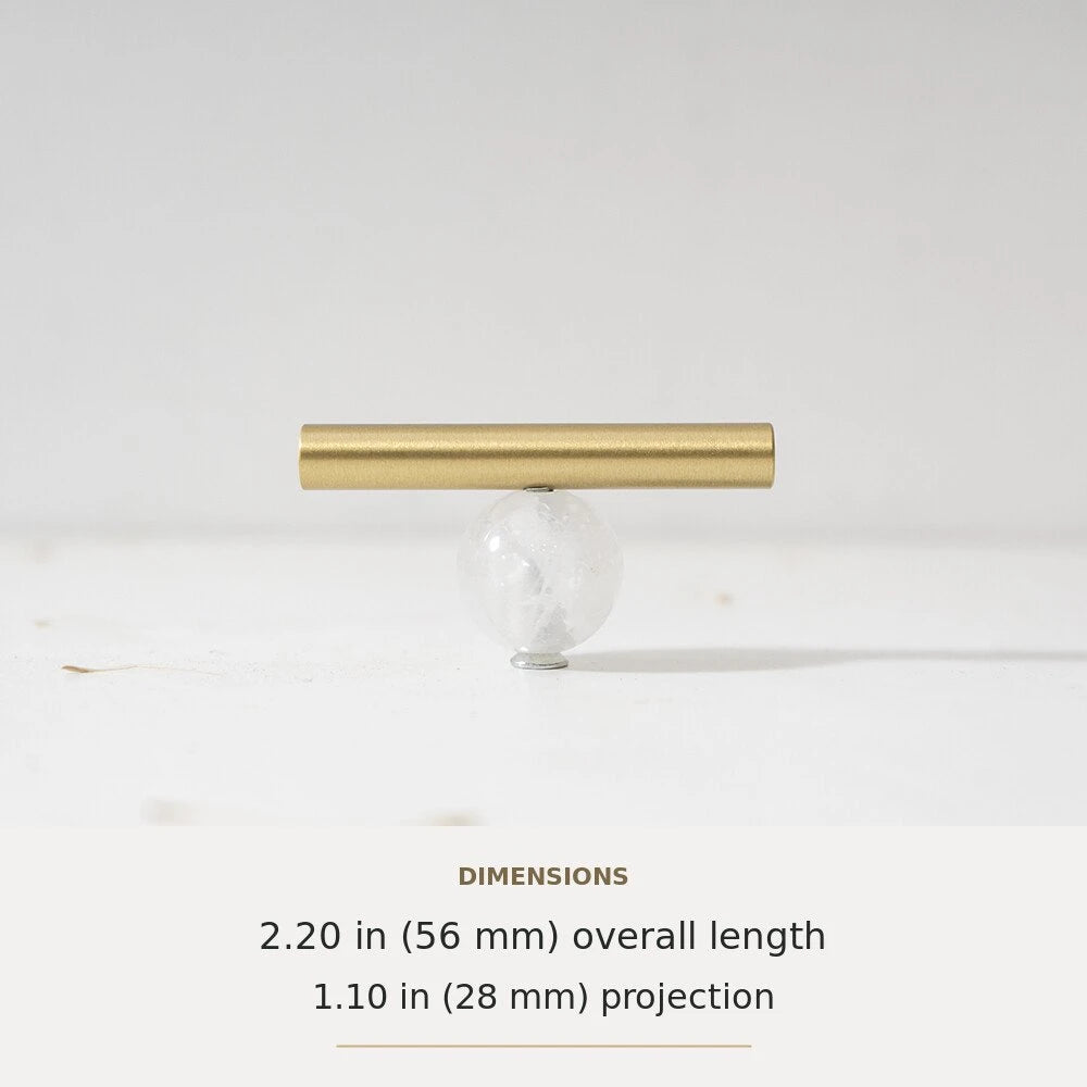 White decorative accent and brass T-bar cabinet knob
