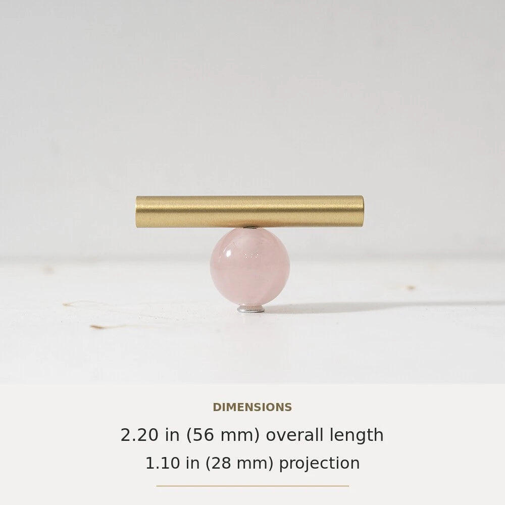 Pink decorative accent and brass T-bar cabinet knob