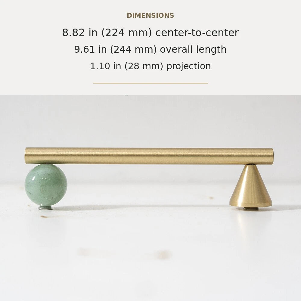 Green decorative accent and brass cabinet pull, 8.82-inch center-to-center
