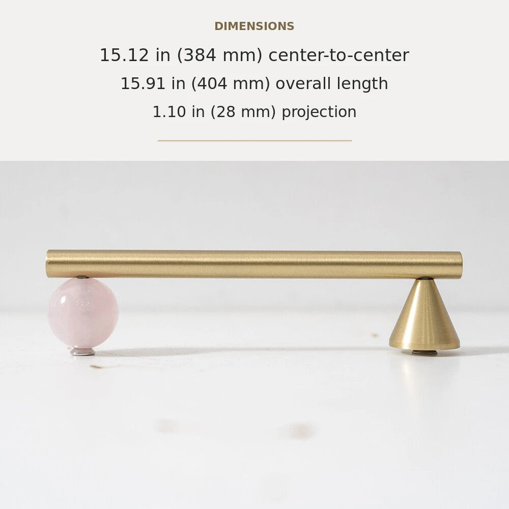 Pink decorative accent and brass cabinet pull, 15.12-inch center-to-center