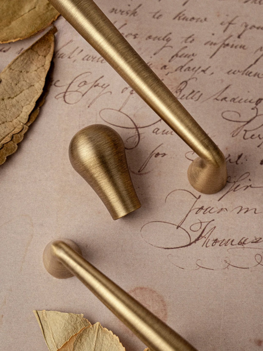 Gold bar on an old document with leaves
