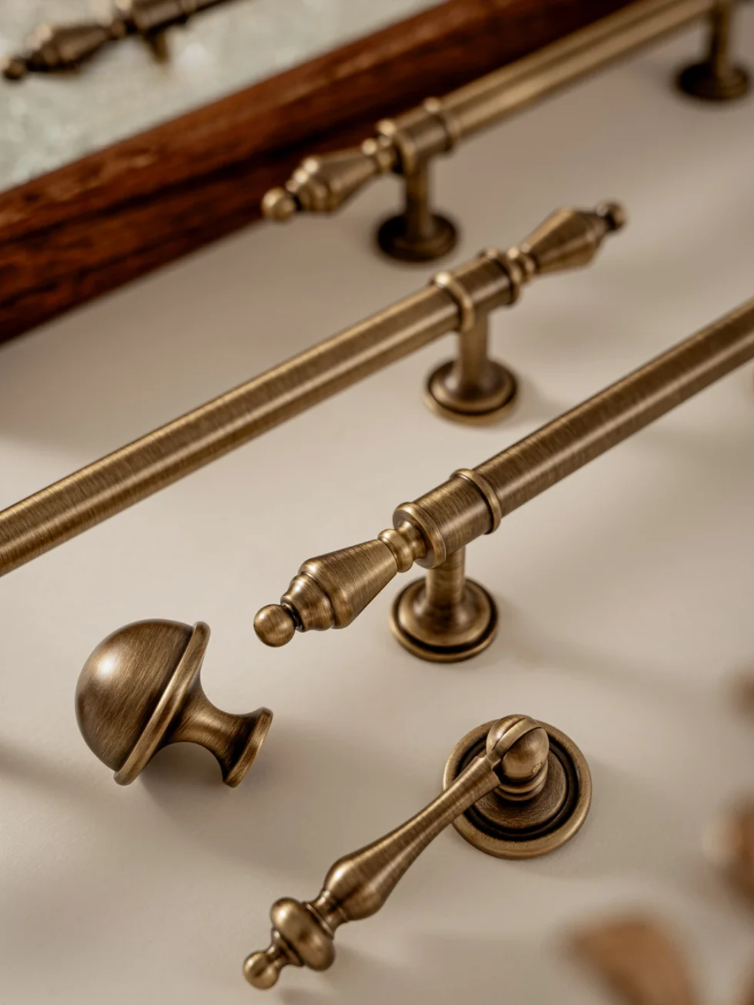 Set of vintage-style brass cabinet handles on a neutral background