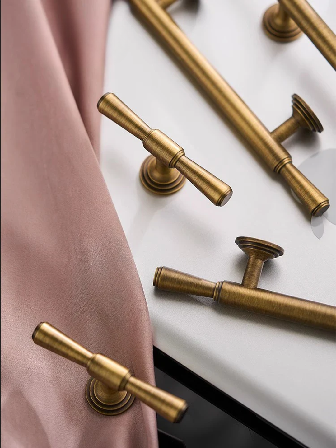 Gold hardware handles on a white surface with 'Santaya' branding.