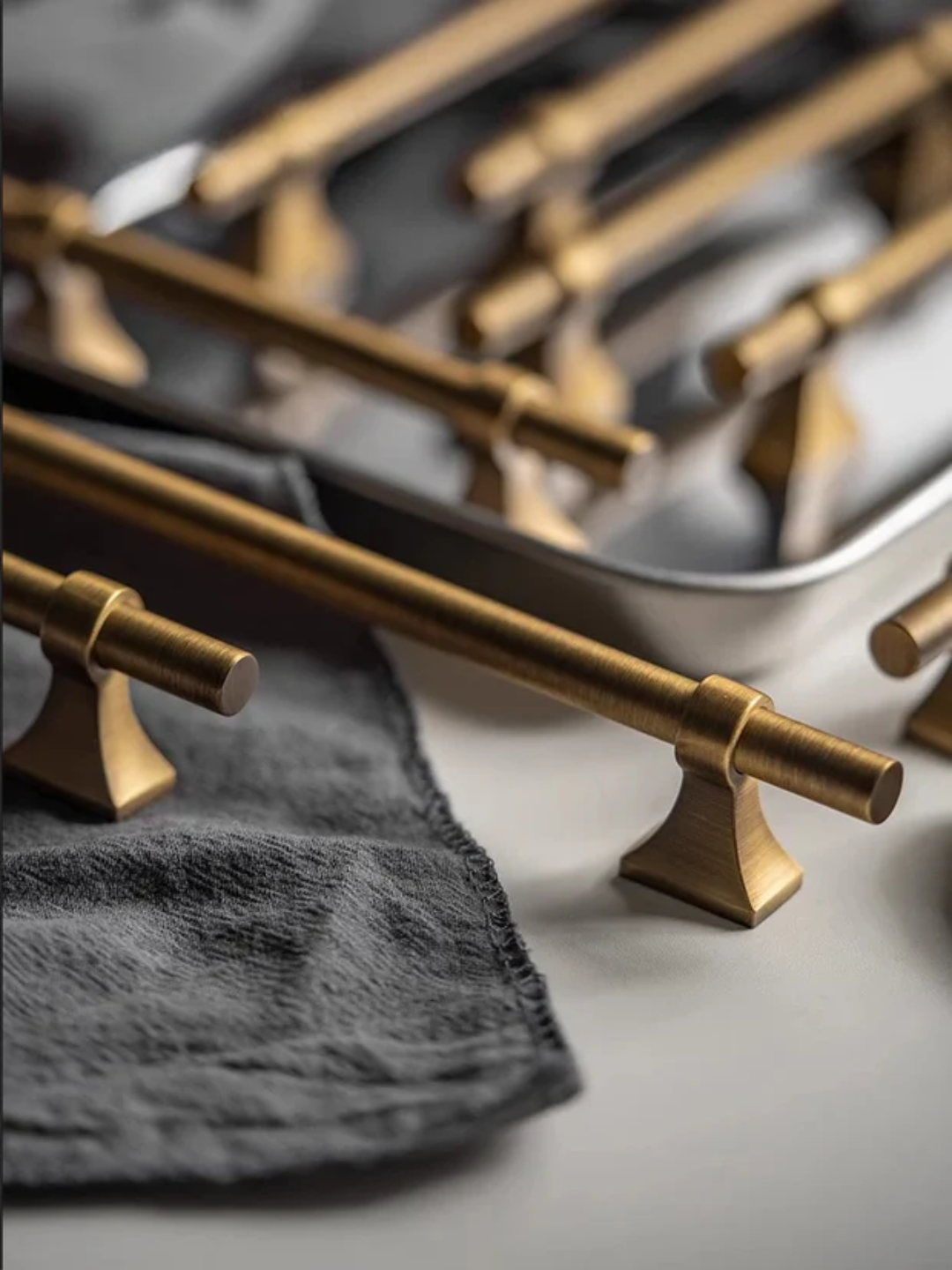 Close-up of gold kitchen knobs on a stove