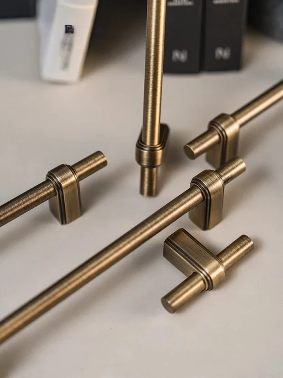 Set of bronze cabinet handles on a light background