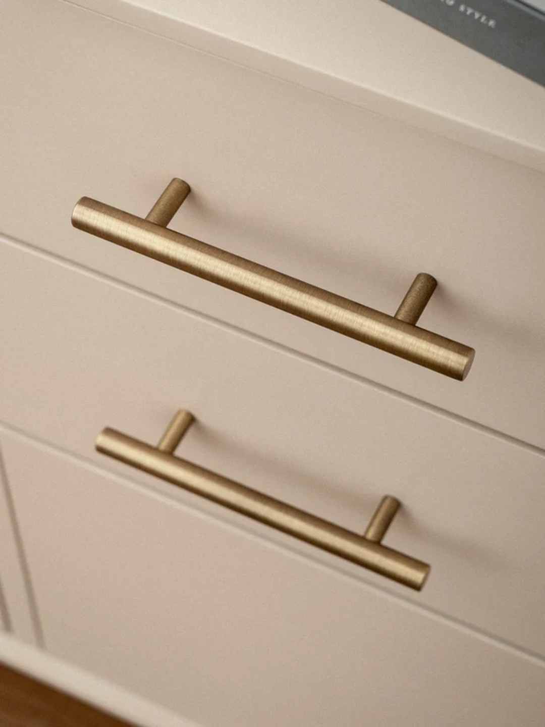 Beige cabinet with gold handles and 'Santaya' branding.