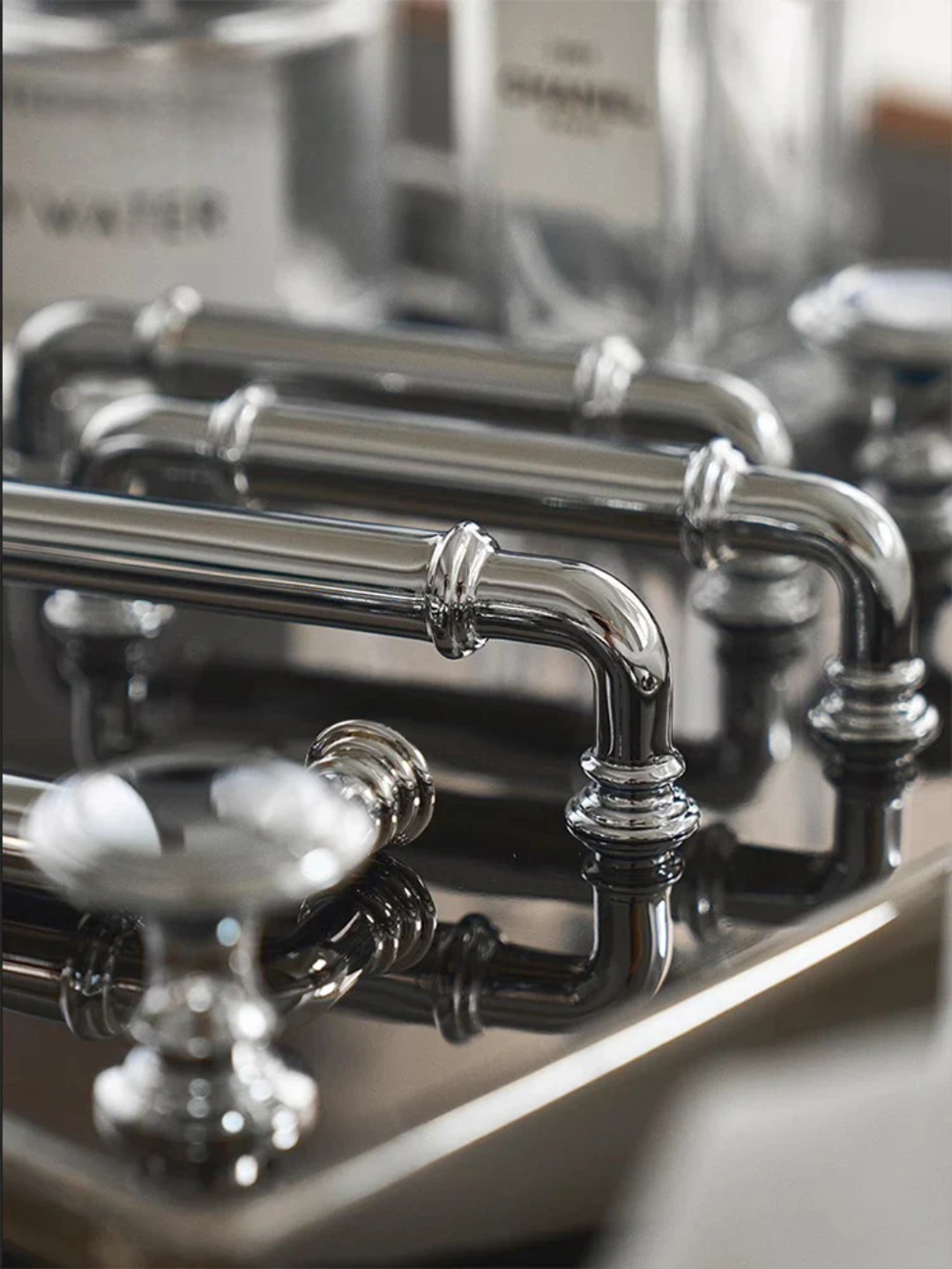 Close-up of metallic handles on a cabinet or drawer