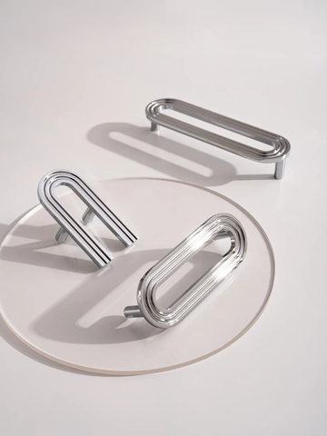 Set of silver earrings on a light gray background