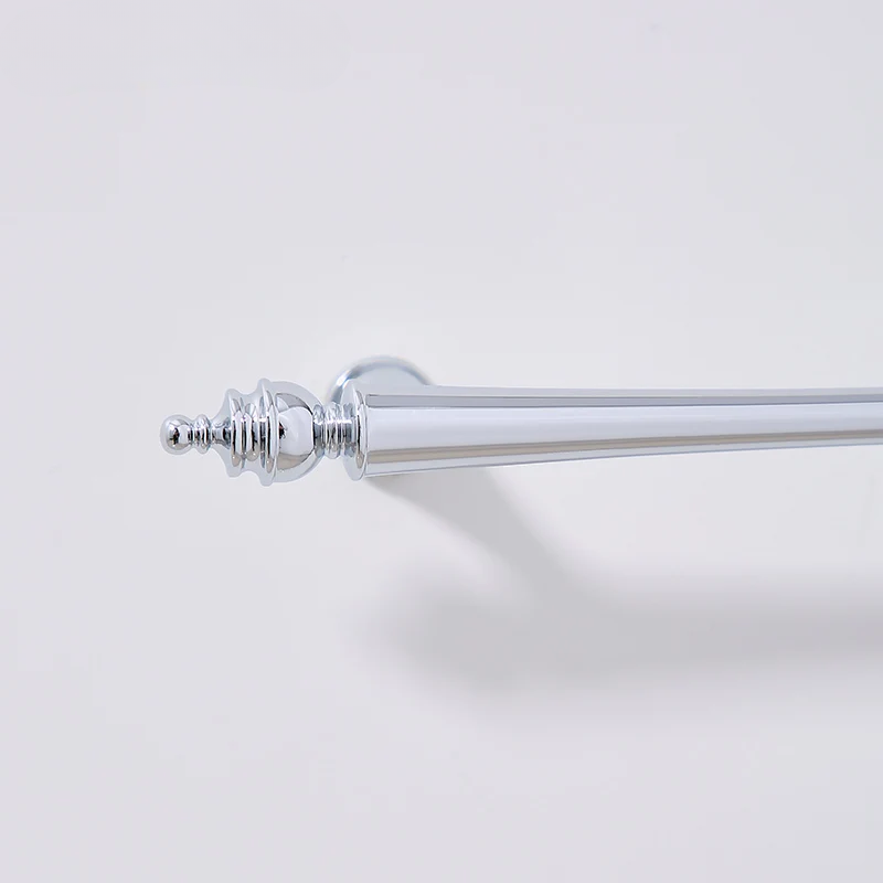 Curtain rod with decorative finial on a light gray background