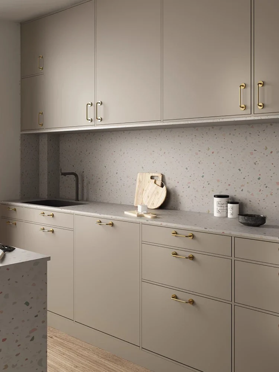 Modern kitchen with gray cabinets, white countertop, and speckled backsplash.