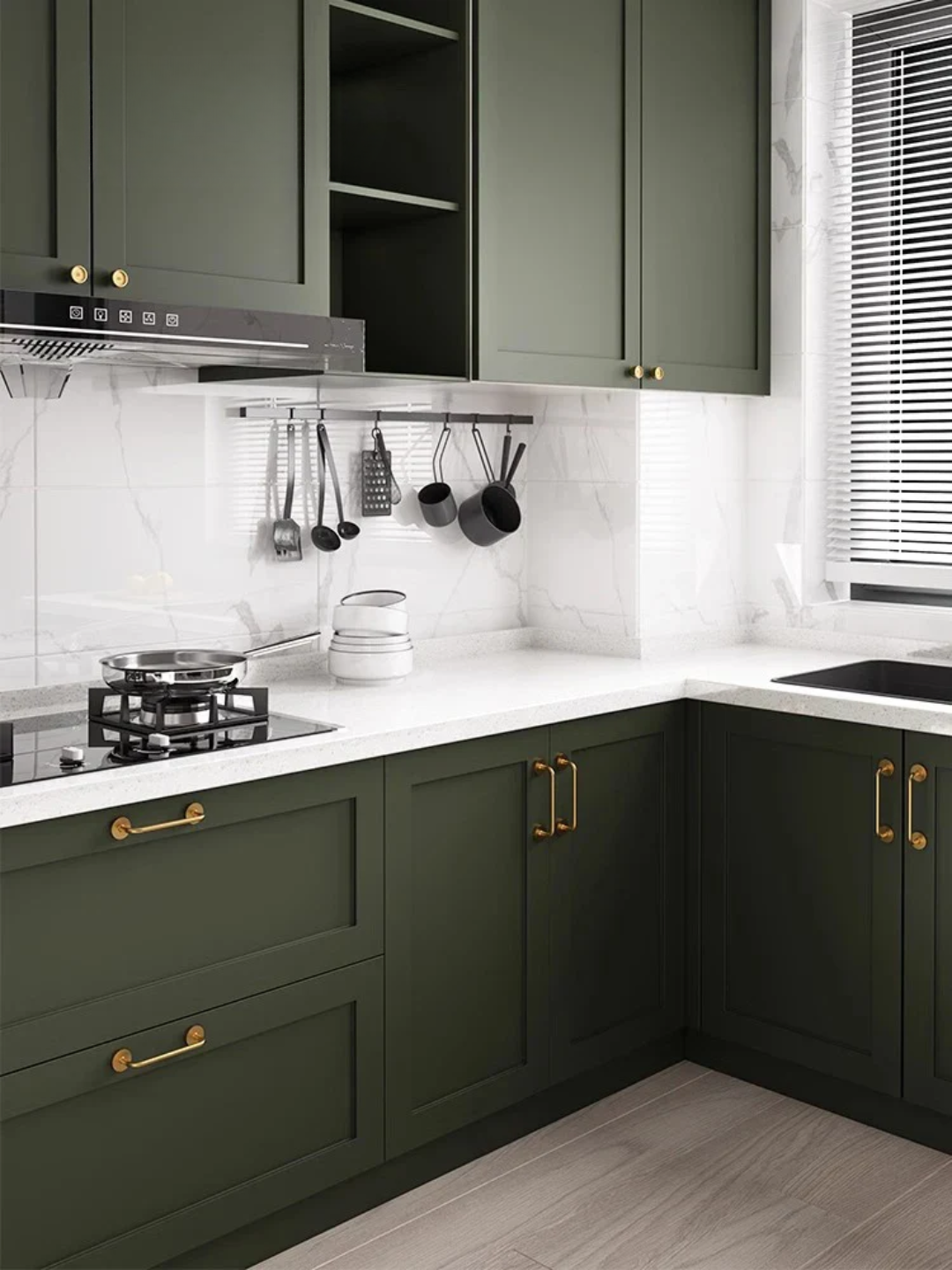 Modern kitchen with green cabinets, white countertops, and gold hardware, featuring the Santaya brand.