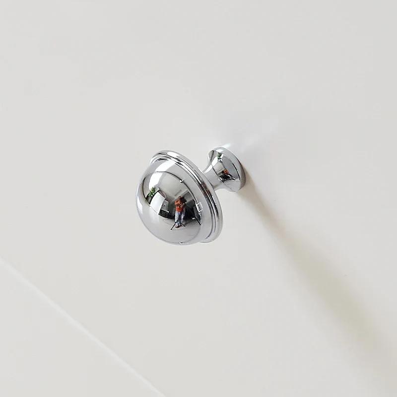 Chrome door handle on a white background