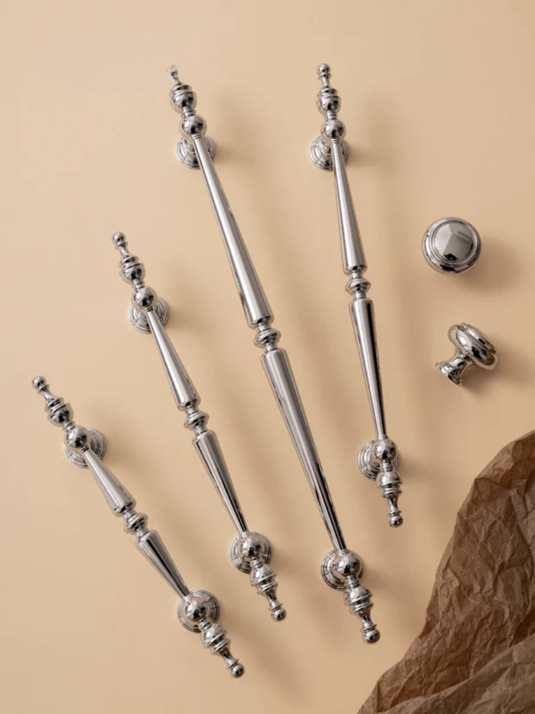 Set of silver decorative elements on a beige background