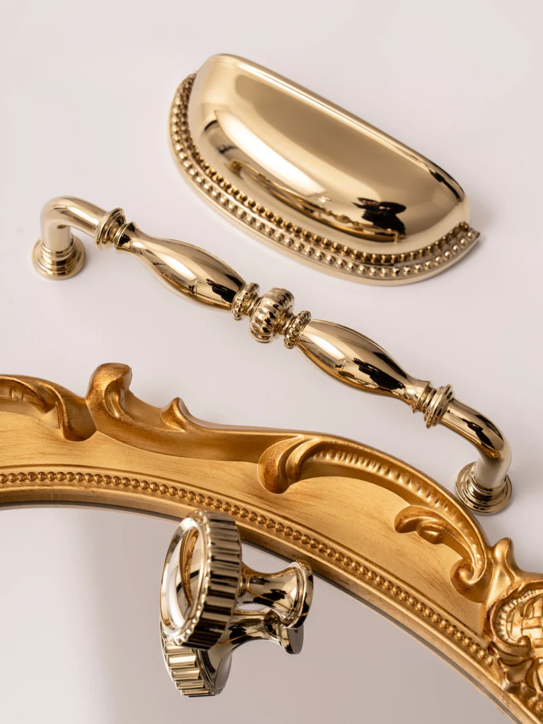 Gold bathroom fixtures including a handle and soap dish on a light background with 'Santaya' branding.