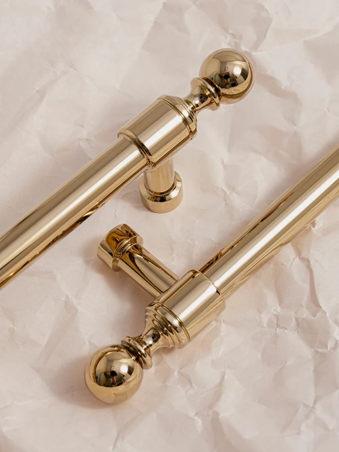 Gold handles on a textured beige background with 'Santaya' branding.