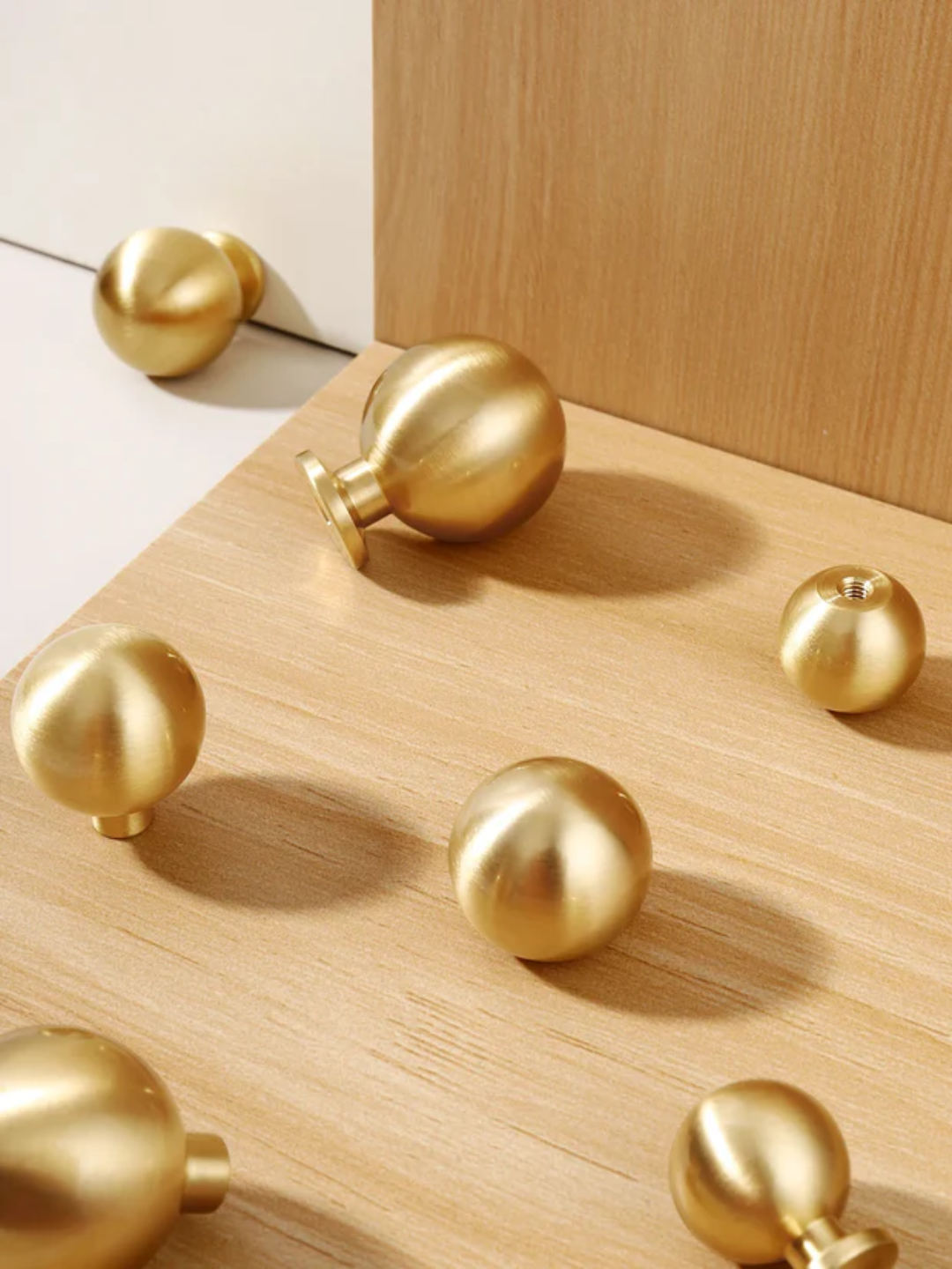 Gold spherical objects on a wooden surface