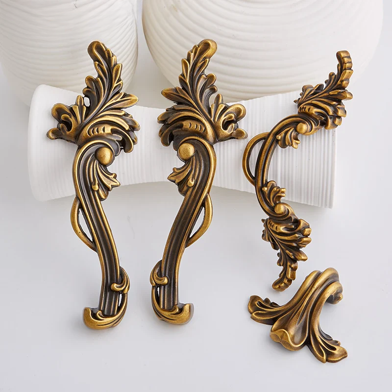 Decorative gold handles on a white background