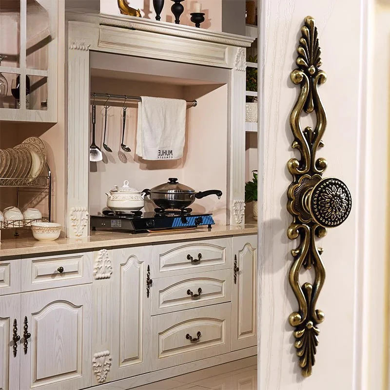 Decorative kitchen cabinet with a decorative wall piece.