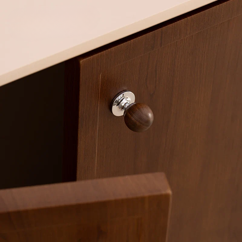 Wooden drawer with a knob on a wooden cabinet