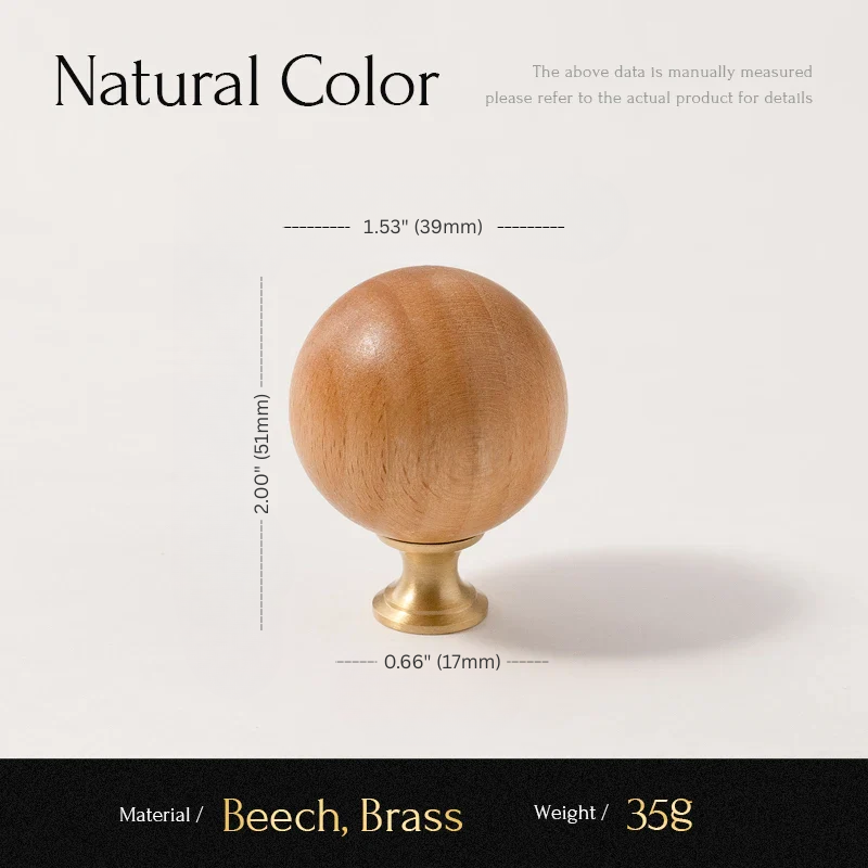 Wooden sphere with brass base and measurements on a white background