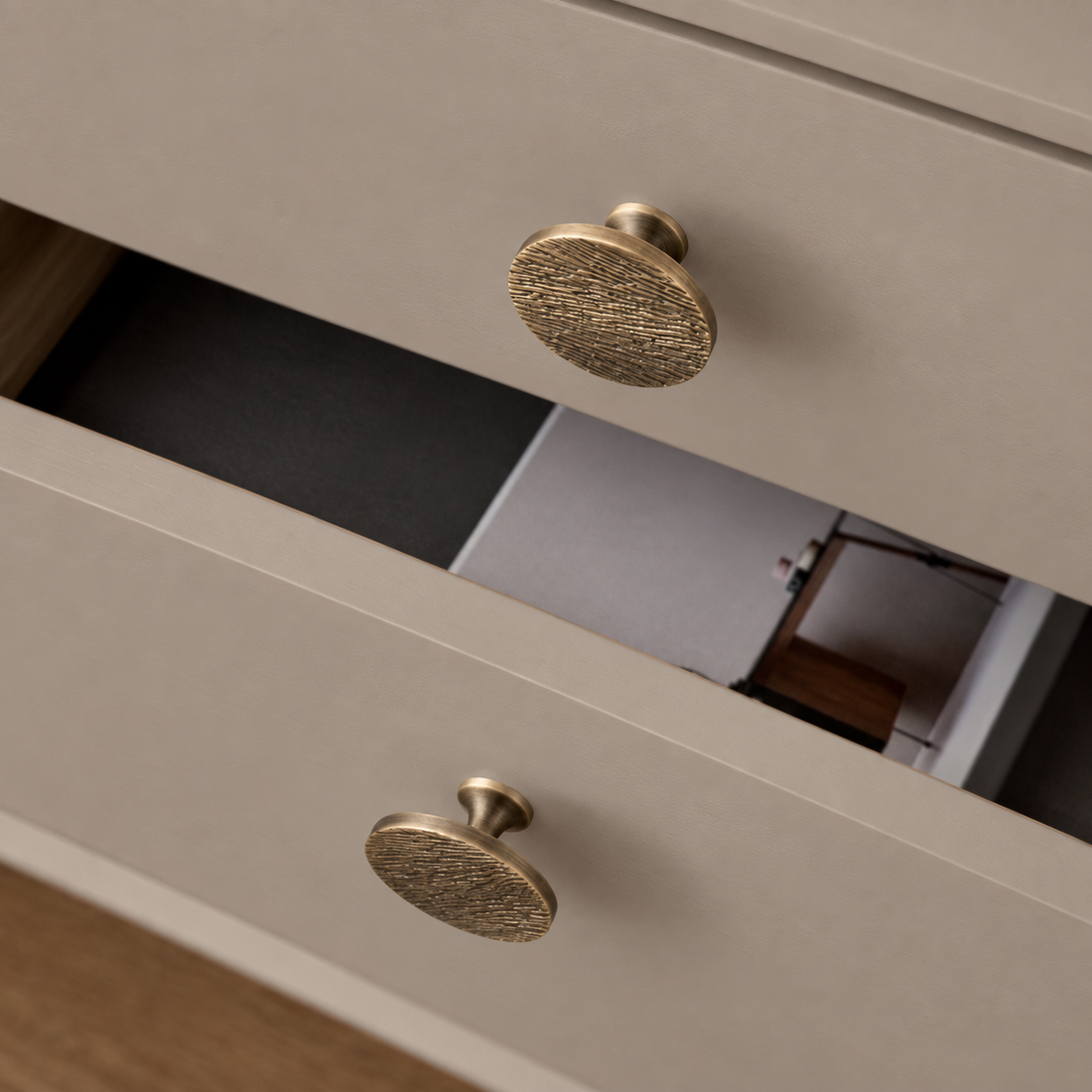Antique Brass Round Cabinet Knob & Pull — Solid Brass Hardware on a deep olive studio background