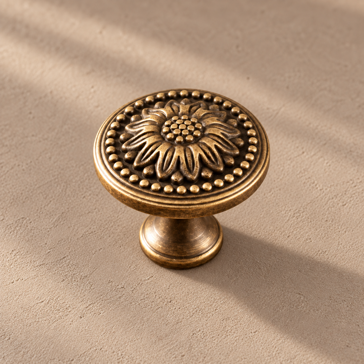 Detail view of antique brass chrysanthemum knob