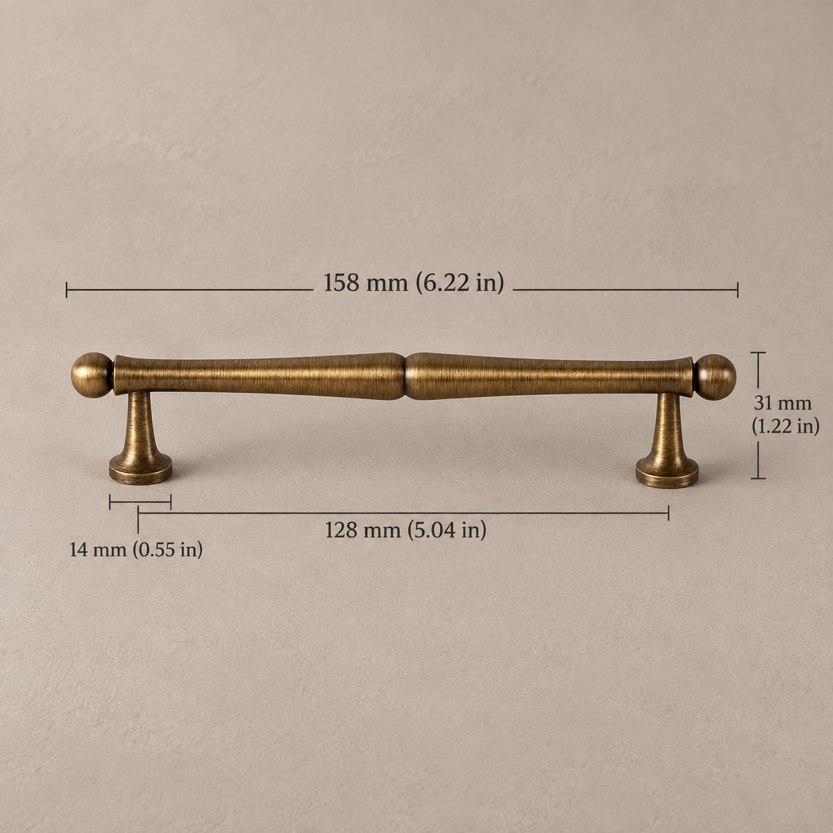 Antique brass classic vintage 128mm on taupe plaster, measurements in mm and inches