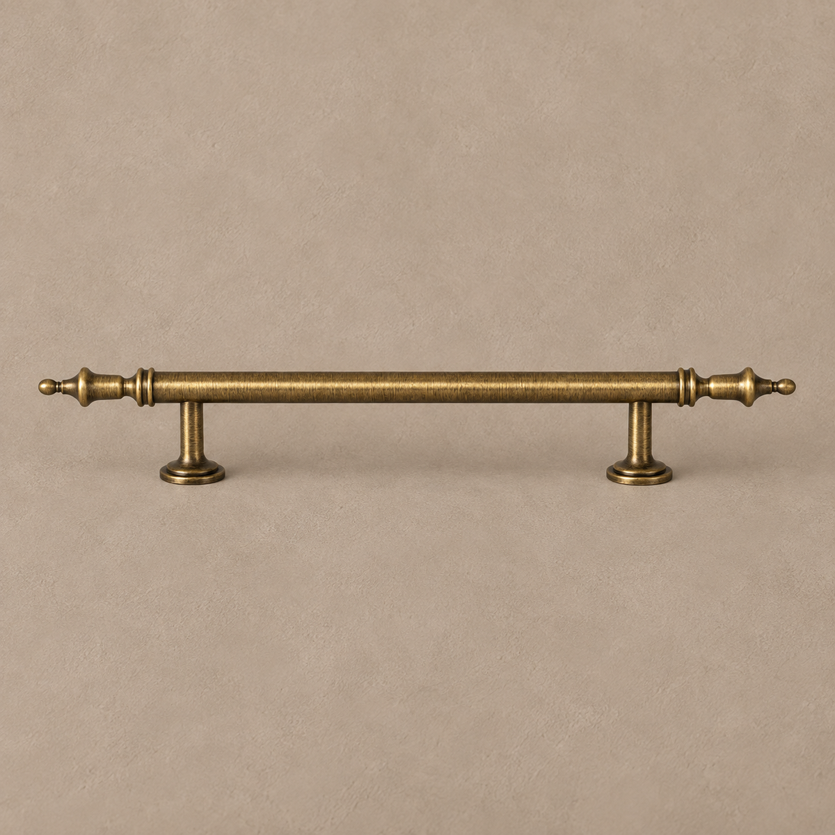 Antique brass crown-style cabinet pull with decorative finials