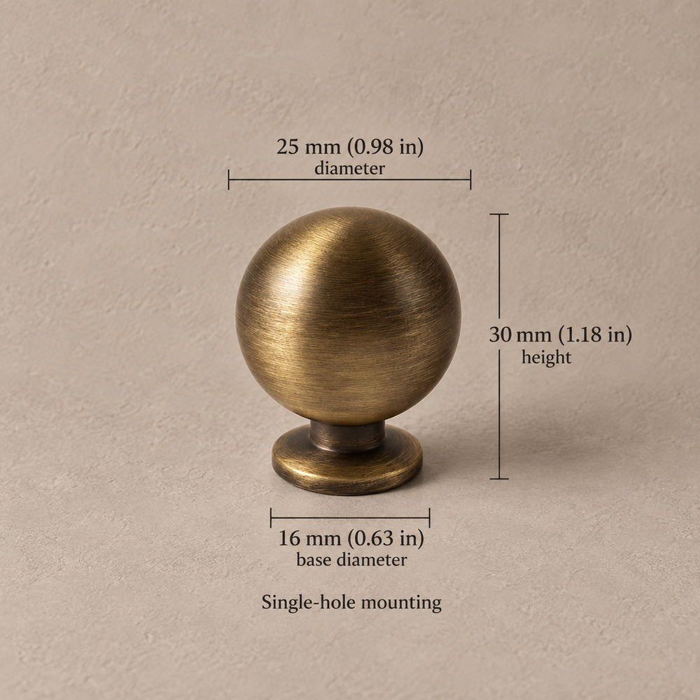 Antique brass European retro 25mm ball knob on taupe plaster, dimensions in mm and inches