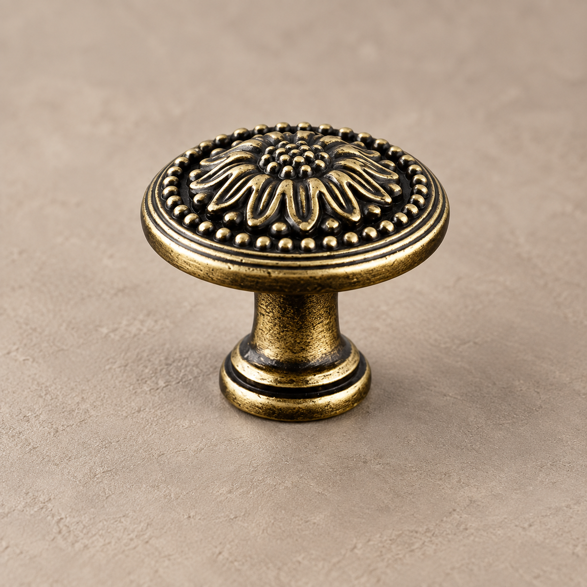 Antique brass floral cabinet knob close-up
