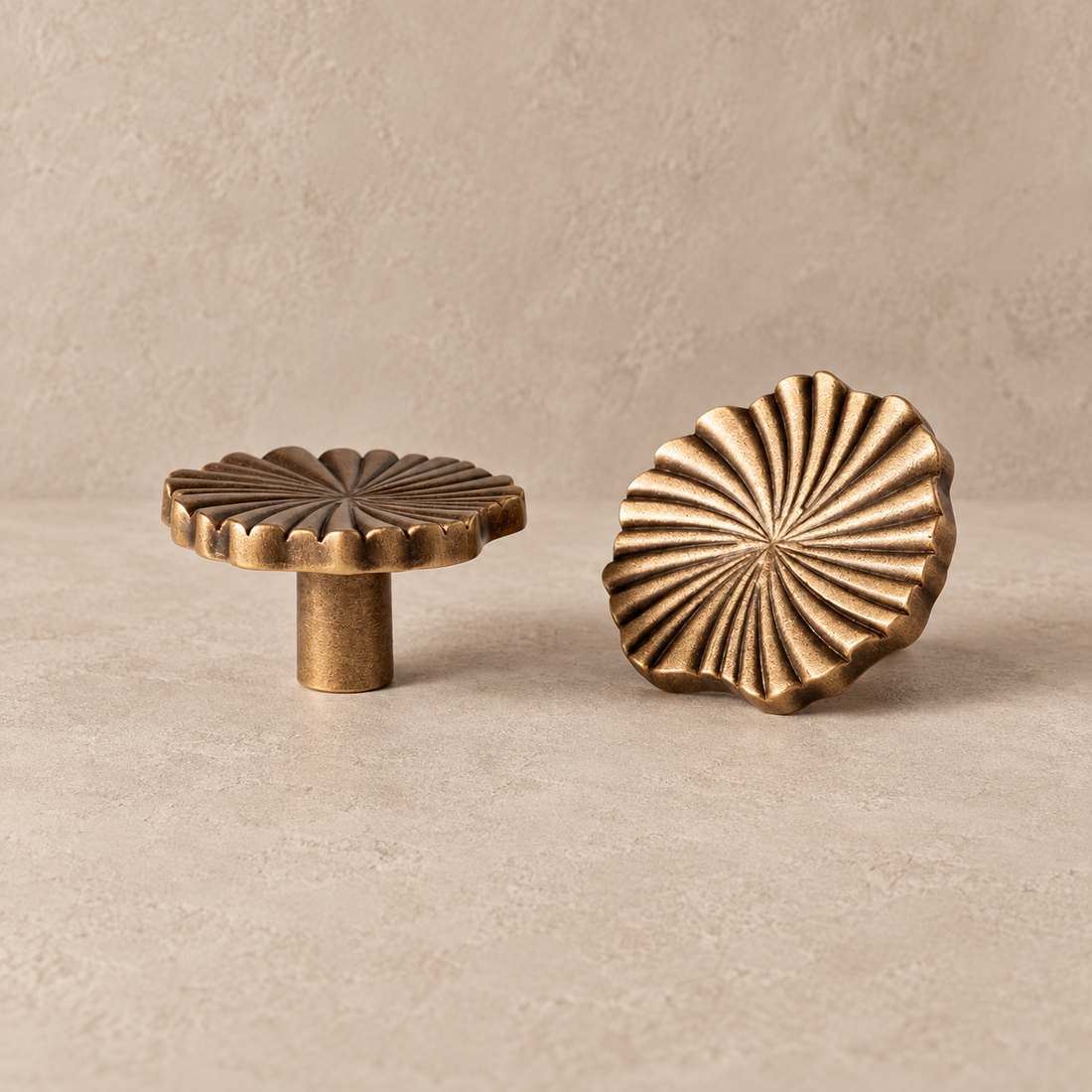Antique Brass Vintage Cup Pulls & Knobs Solid Brass Cabinet Hardware on a neutral stone studio background