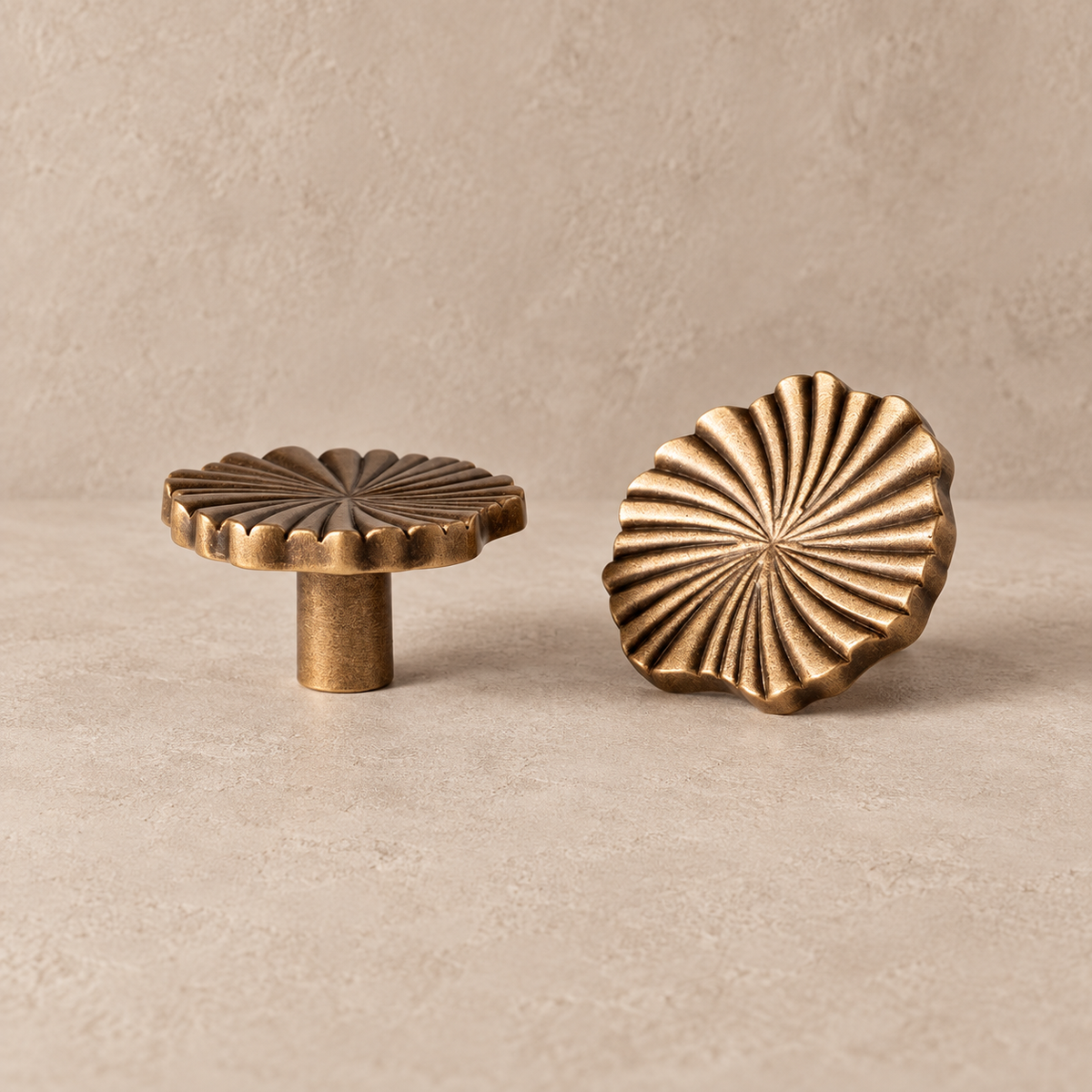 Antique brass radial cabinet knob, front and side views