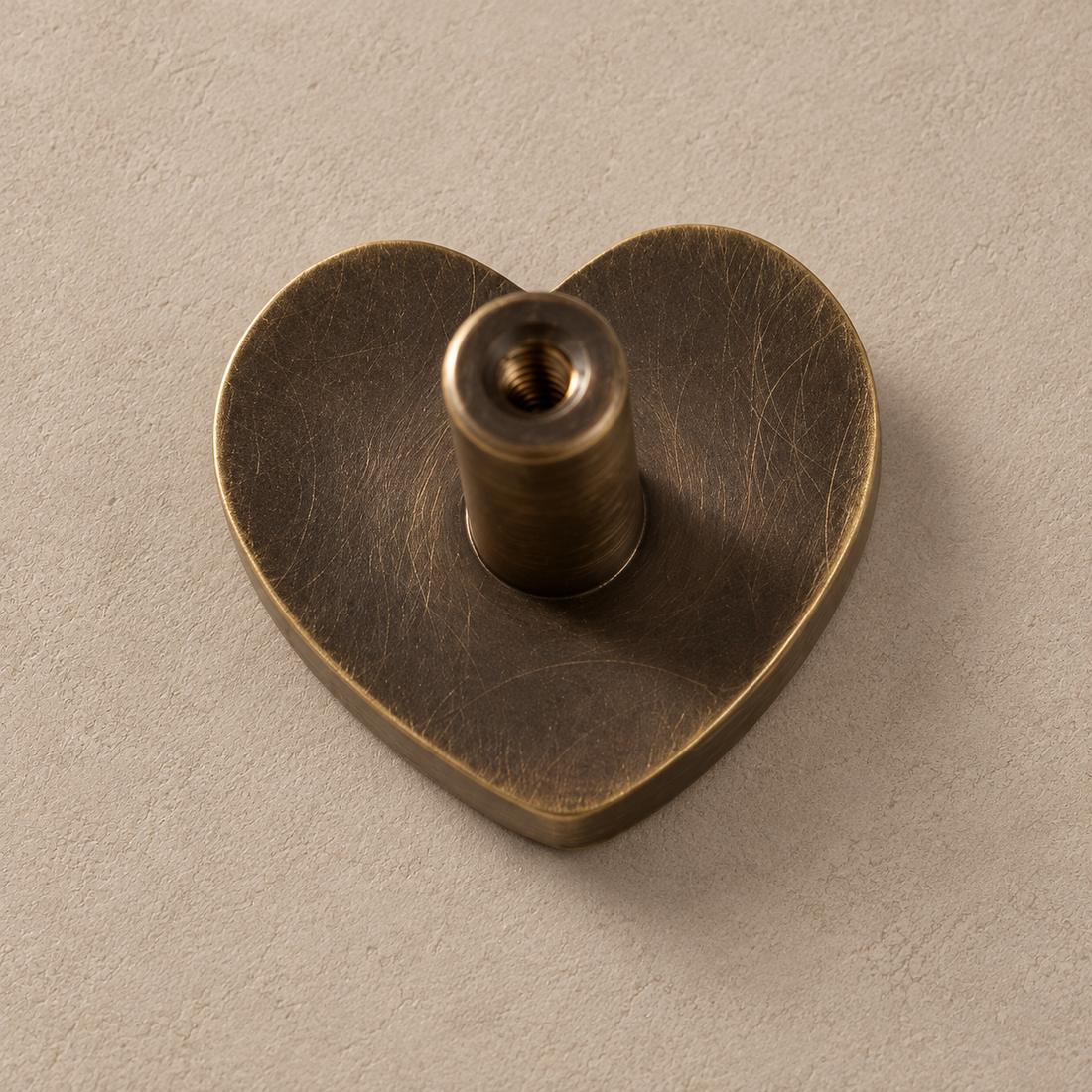 Solid Antique Brass Children’s Cabinet Knobs — Animal & Shape Design on a neutral stone studio background