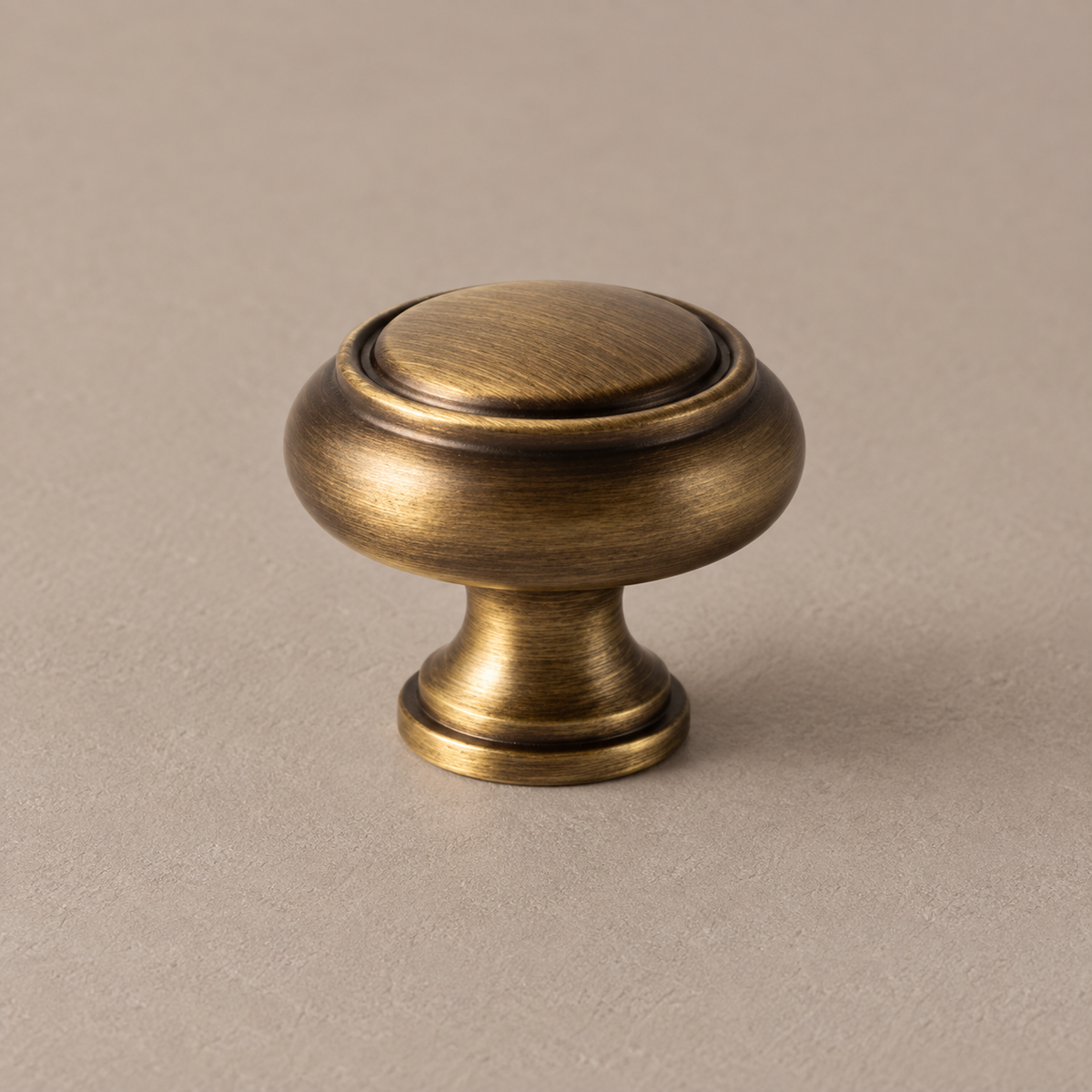 Antique brass round cabinet knob detail