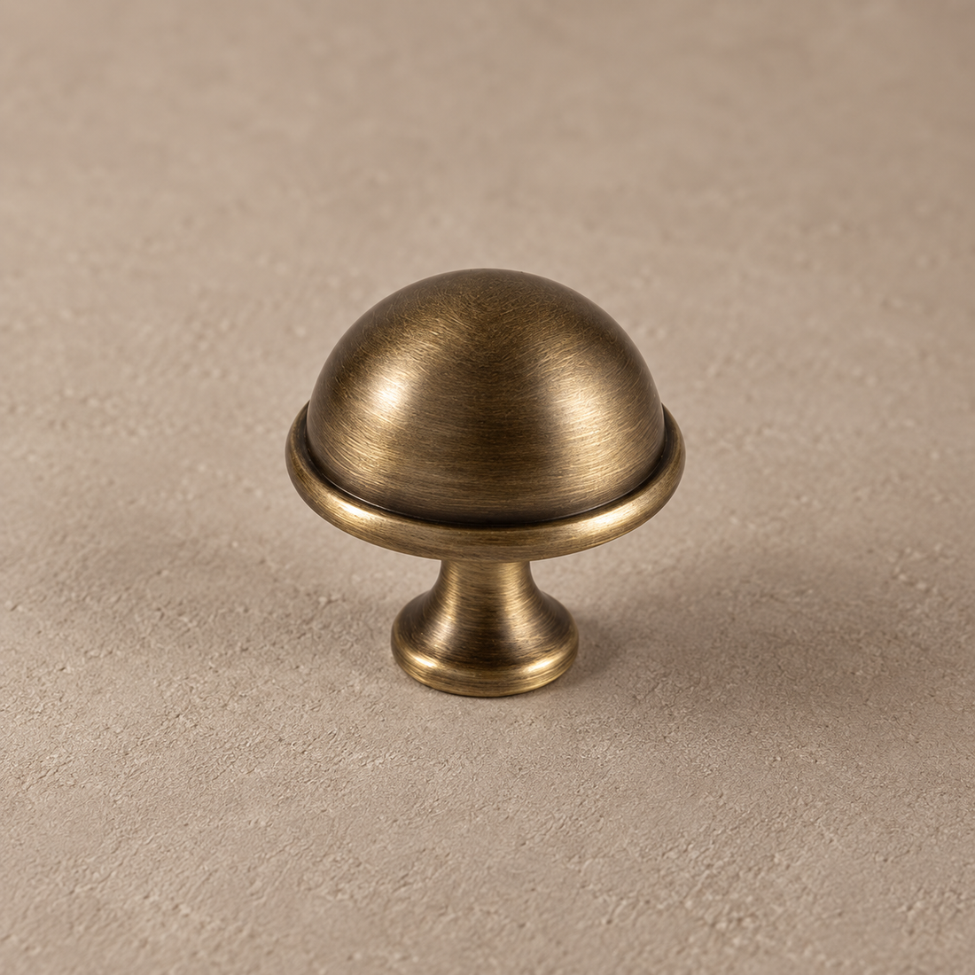Solid Antique Brass Cabinet Pull & Knob — European Luxury Design on a neutral stone studio background