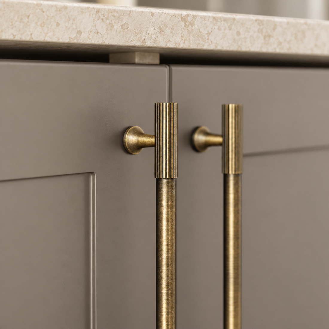 Ribbed Solid Brass Cabinet Pulls & Knobs — Antique Brass on a warm ivory background