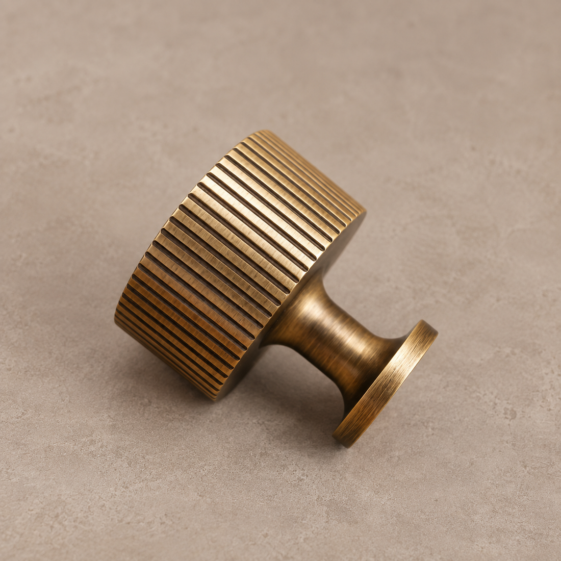 Antique Brass Ribbed Cabinet Pull, Knob & T-Bar - Solid Brass on warm ivory stone