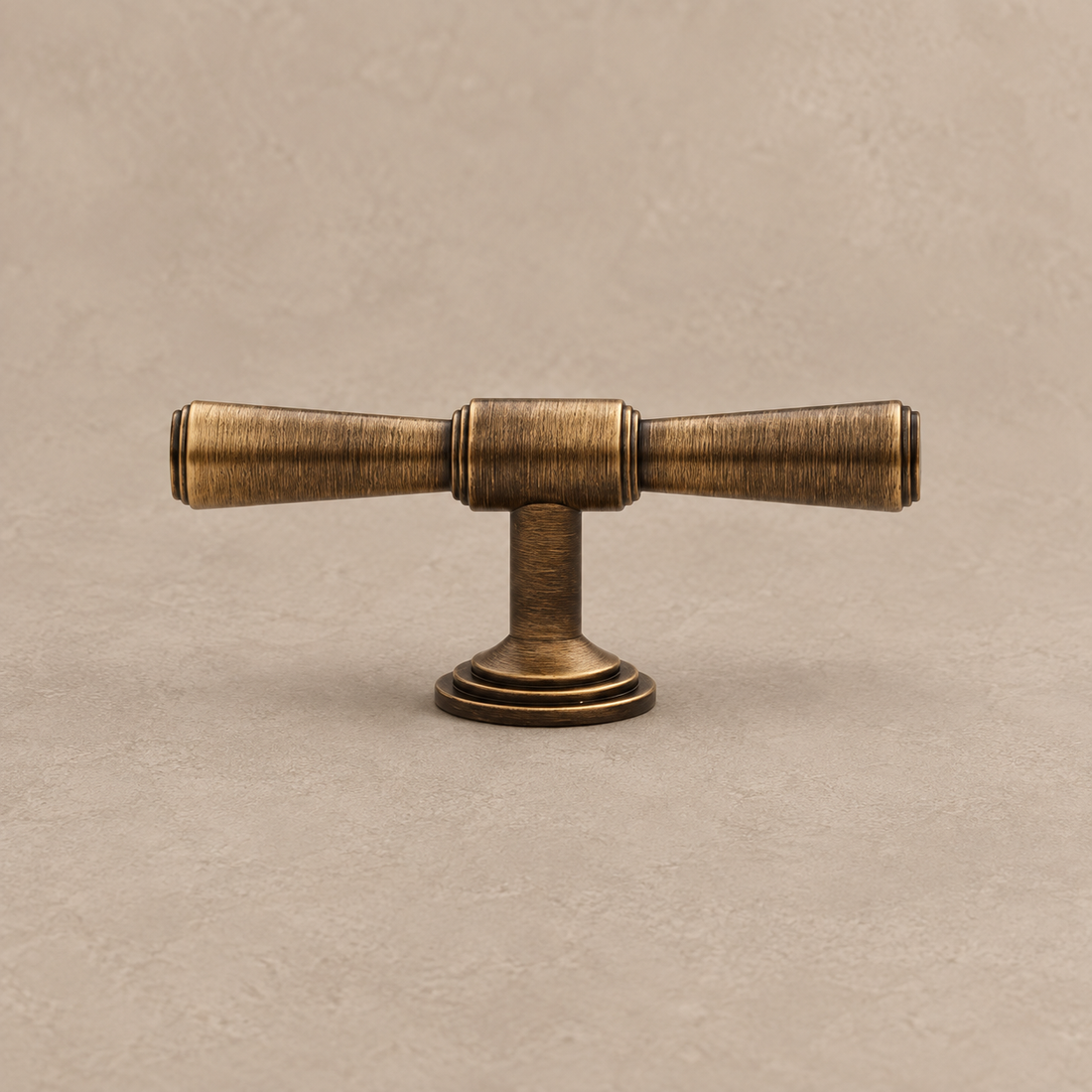T-Bar Cabinet Pull & Knob — Antique Brass on a neutral stone studio background