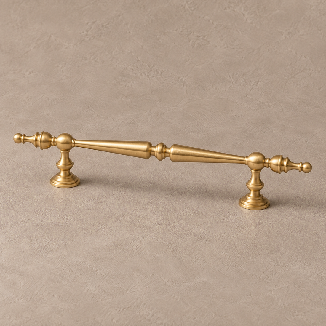 Beaded Spindle Cabinet Pull & Knob — Brushed Brass on warm ivory stone