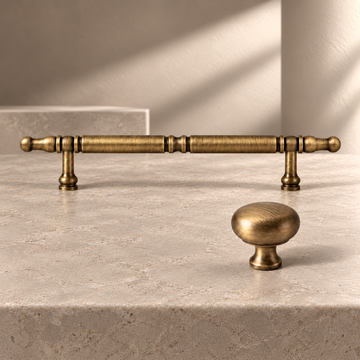 Antique Brass Cabinet Pulls & Knobs — Retro Modern Design on a neutral stone studio background