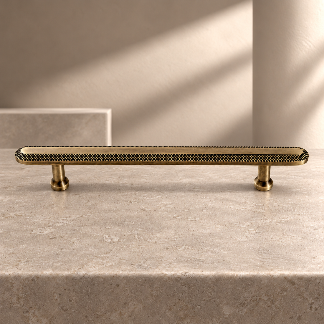 Knurled Grid Solid Brass Cabinet Pull & Knob — Antique Brass on a neutral stone studio background