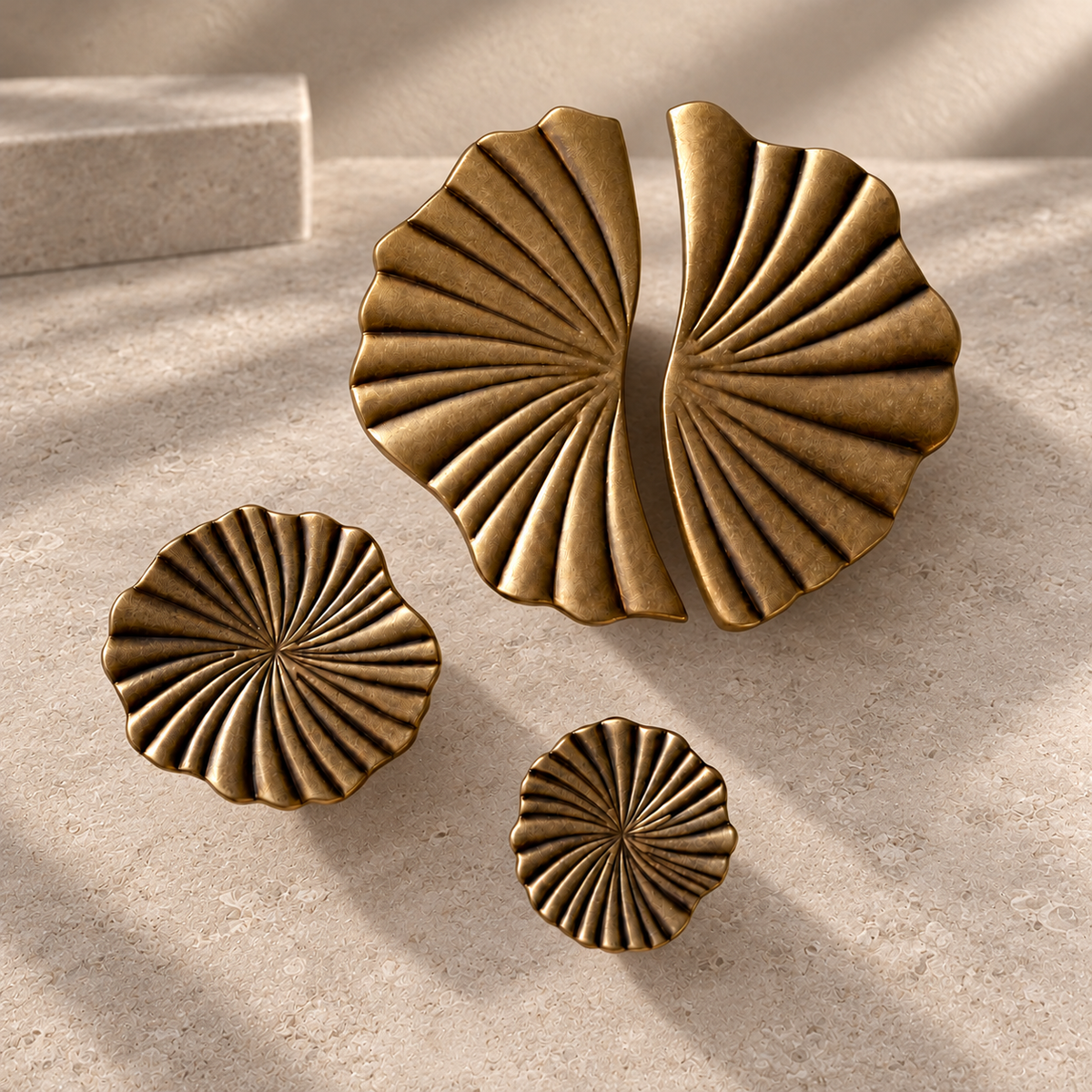 Antique Brass Vintage Cup Pulls & Knobs Solid Brass Cabinet Hardware on a neutral stone studio background